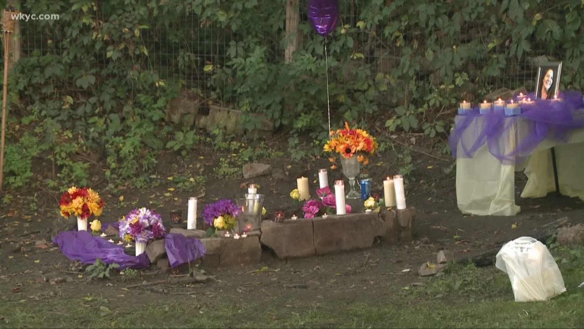 Vigil held for Akron woman after body found in shallow grave