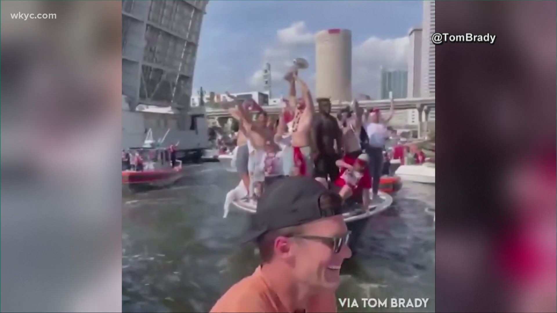 tom brady tossing the lombardi trophy