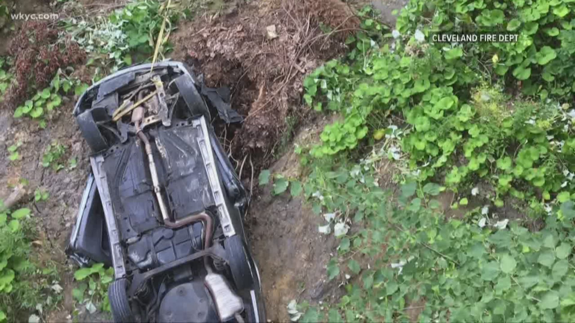 Police investigating car found flipped over cliff