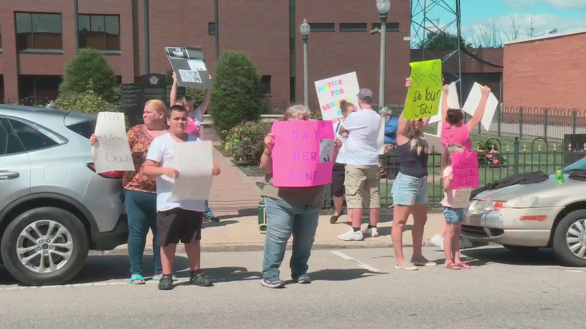 The protest is occurring in front of the office of Ashtabula County Prosecutor Colleen O'Toole.