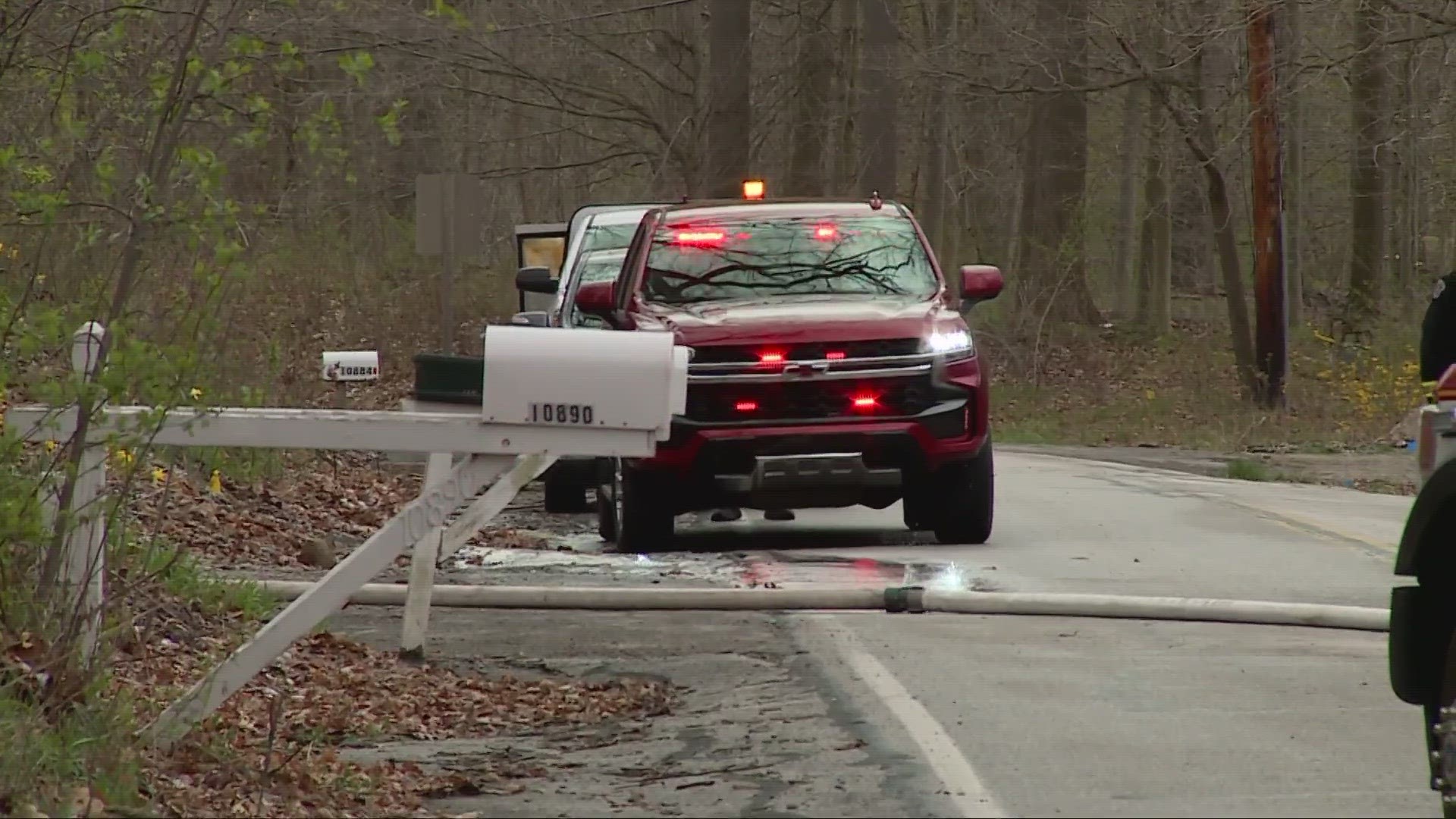 An 89-year-old man allegedly pulled a gun on police and blocked firefighters' access to the barn before eventually being taken into custody.