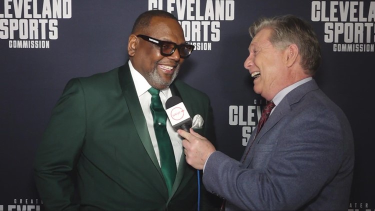 Jim Donovan talks with Glenville football coach Ted Ginn Sr. at Greater Cleveland Sports Awards