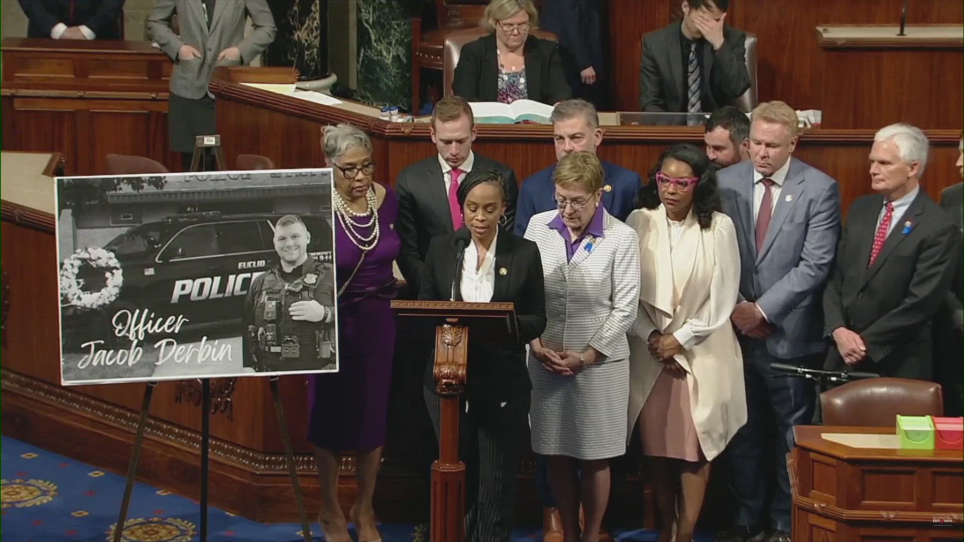 Rep. Shontel Brown was joined in holding a moment of silence in honor of officer Derbin on Thursday.
