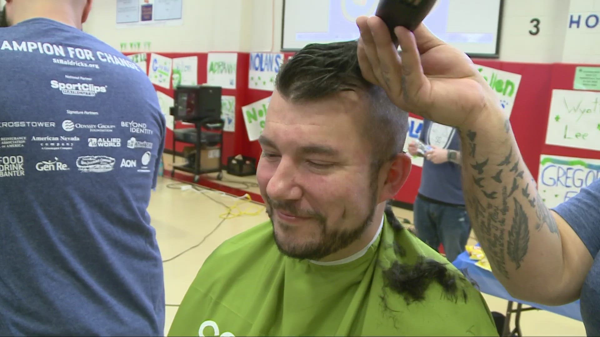 Dozens of kids shave heads for cancer research.