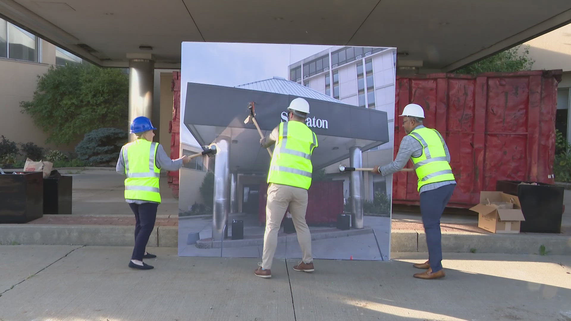 The demolition started with a symbolic moment as sledgehammers were slammed into an image of the building.