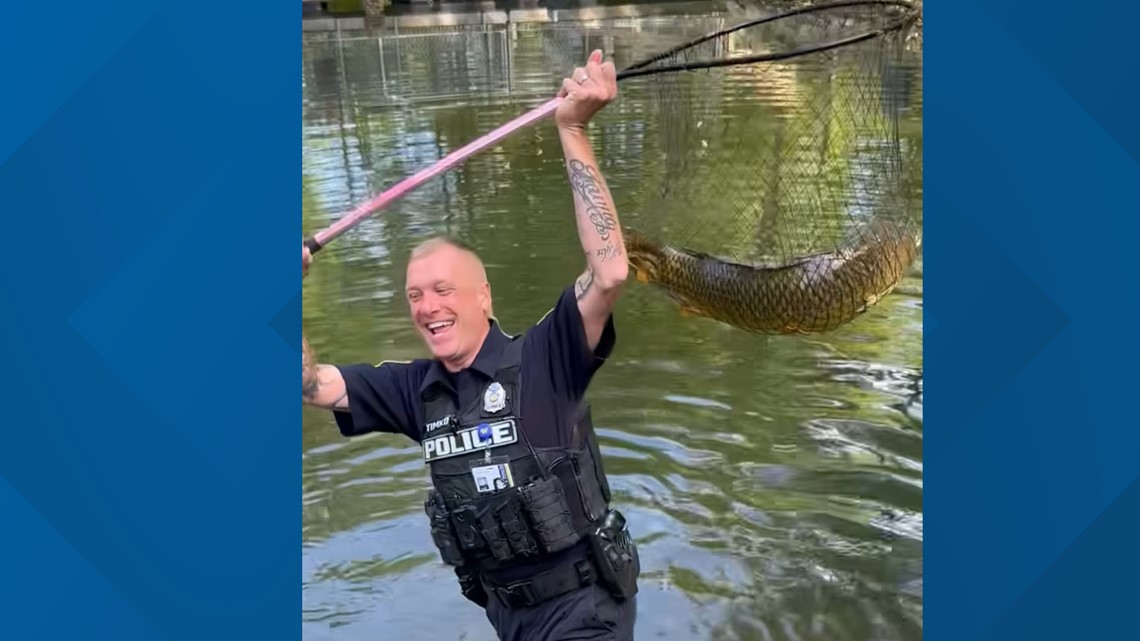 Wooster police officer helps boy catch 15-pound fish