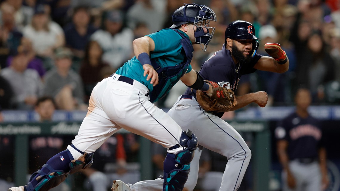 Seattle Mariners' Cal Raleigh wears the Home Run helmet after hitting a two-run  home run off Cleveland Guardians relief pitcher Trevor Stephan during the  eleventh inning of a baseball game in Cleveland