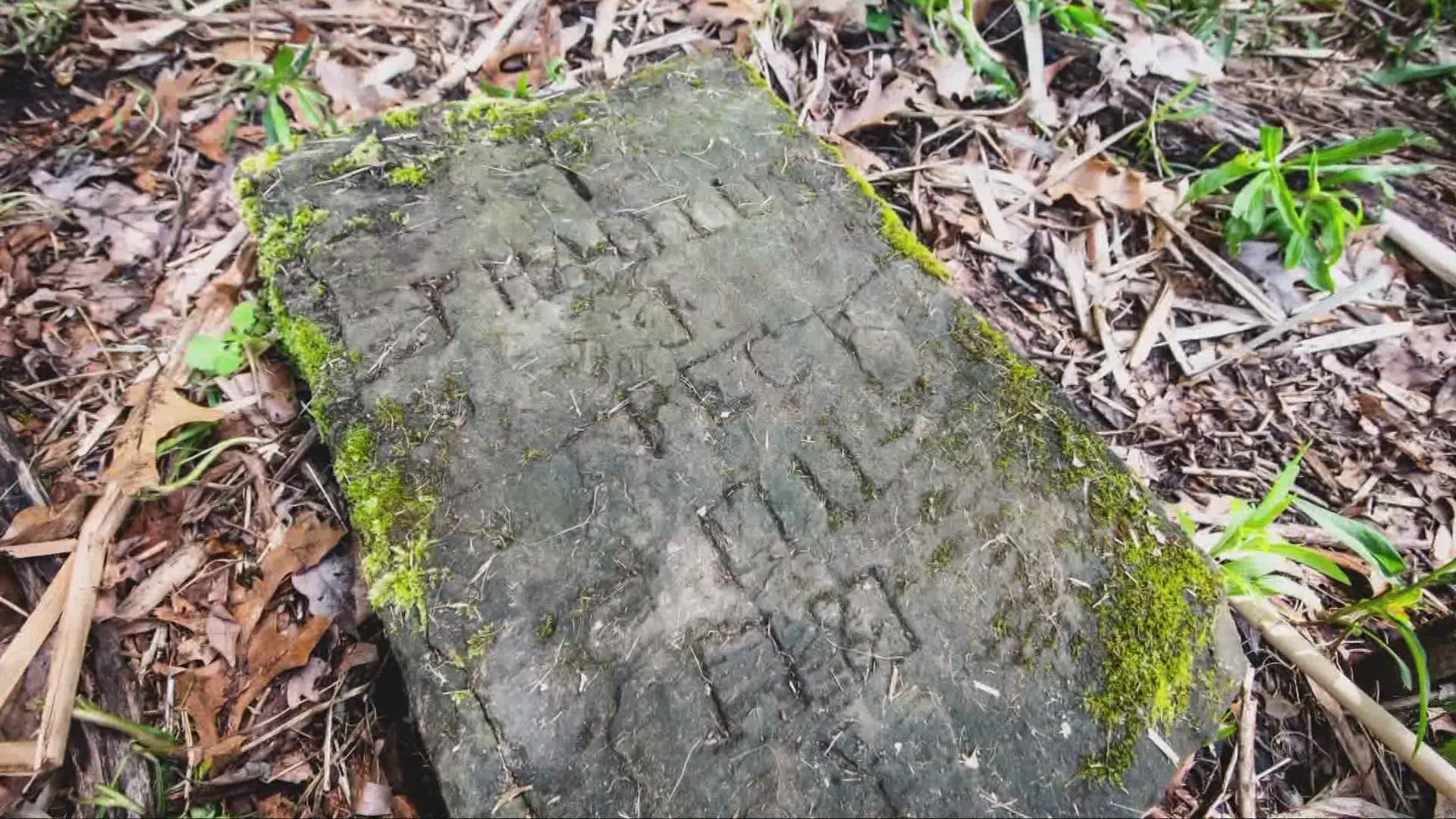 The name etched on the stone is Thadius Peck (1711-1781). The gravestone weighs over 200 pounds and measures 24"x15"x6." It was found along the Cuyahoga River.