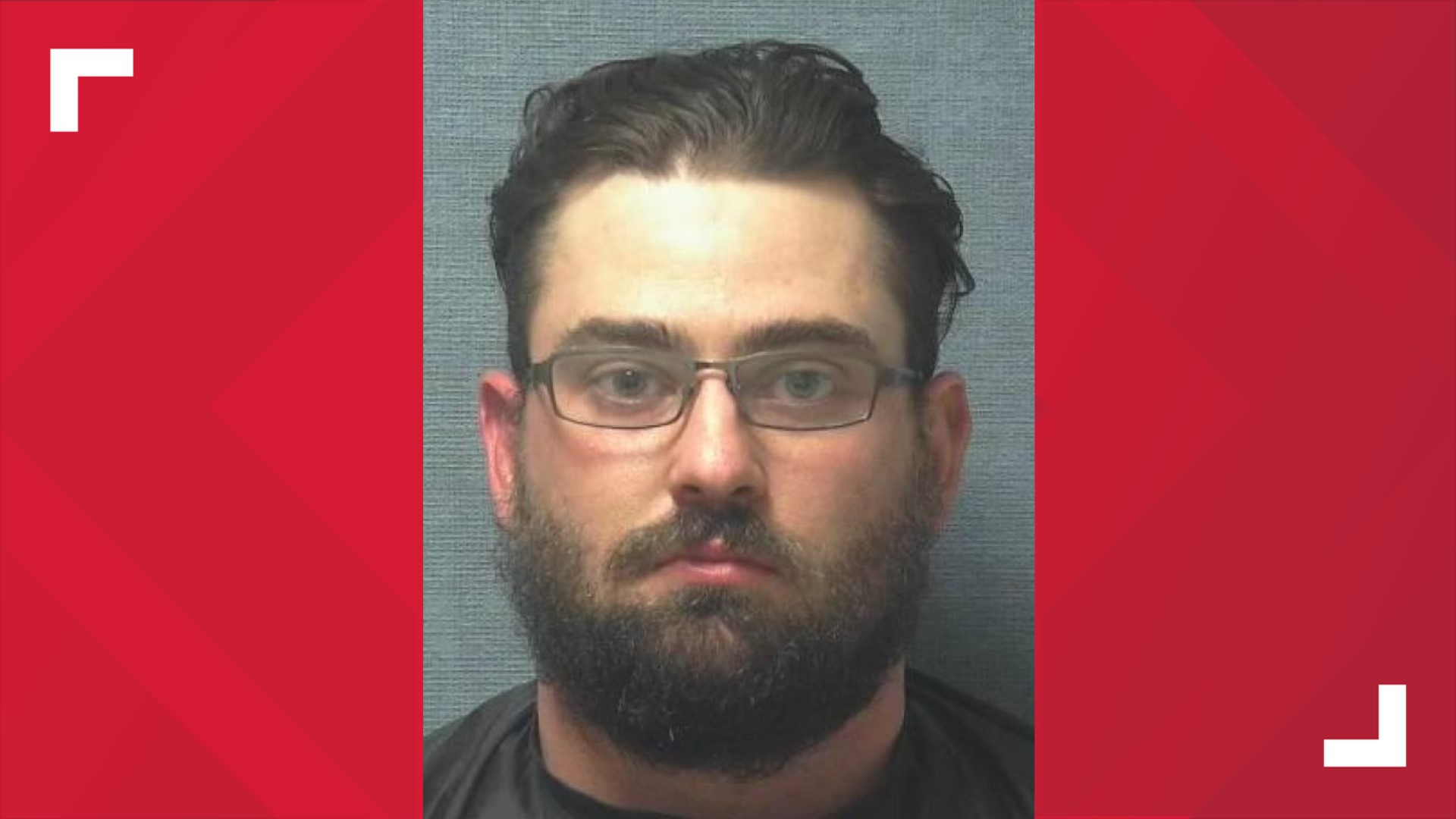 Man arrested after allegedly pointing firearm at group of protesters in ...