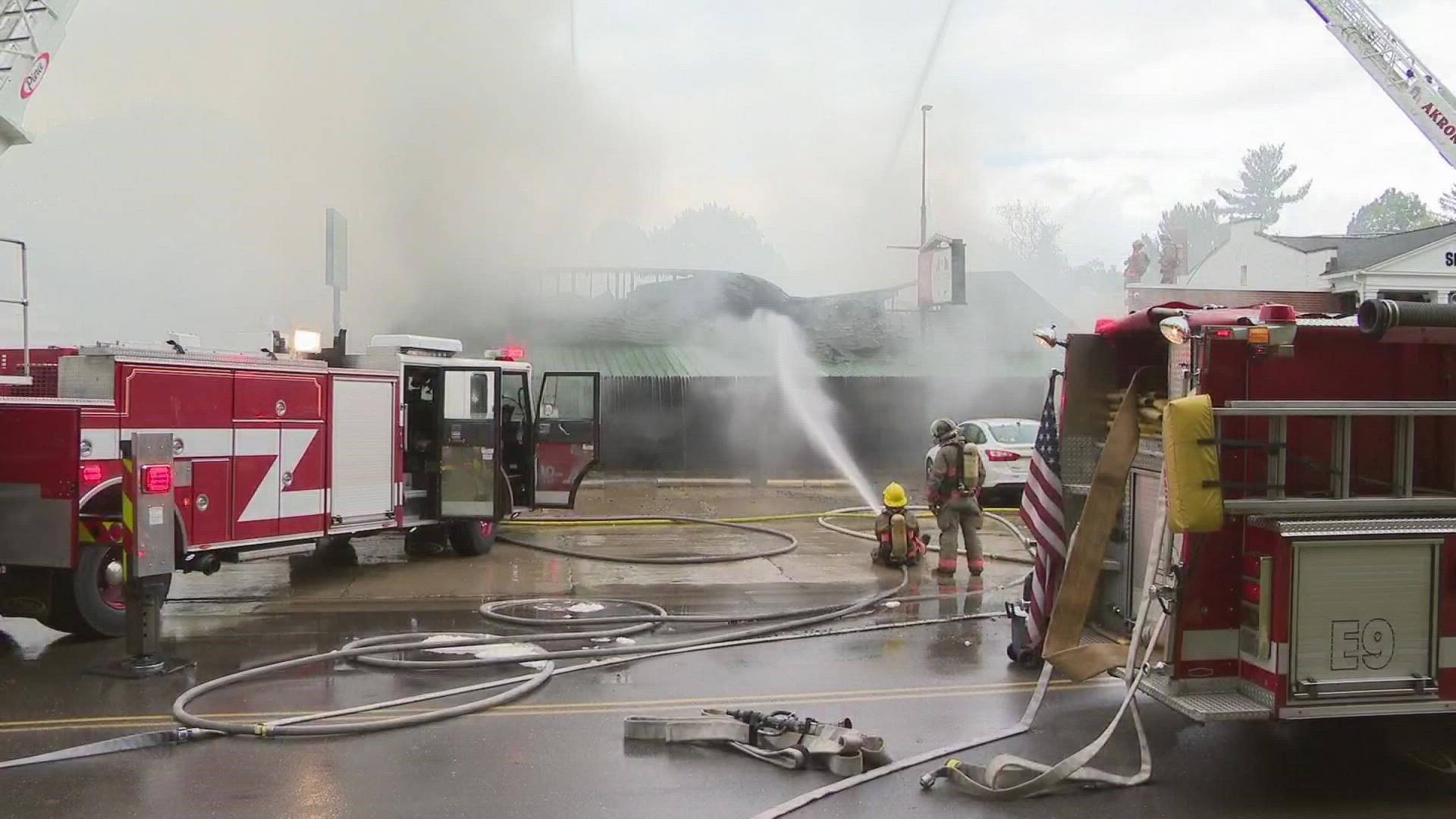 Firefighters have been battling a massive fire at Pavona's Pizza Joint in Akron.