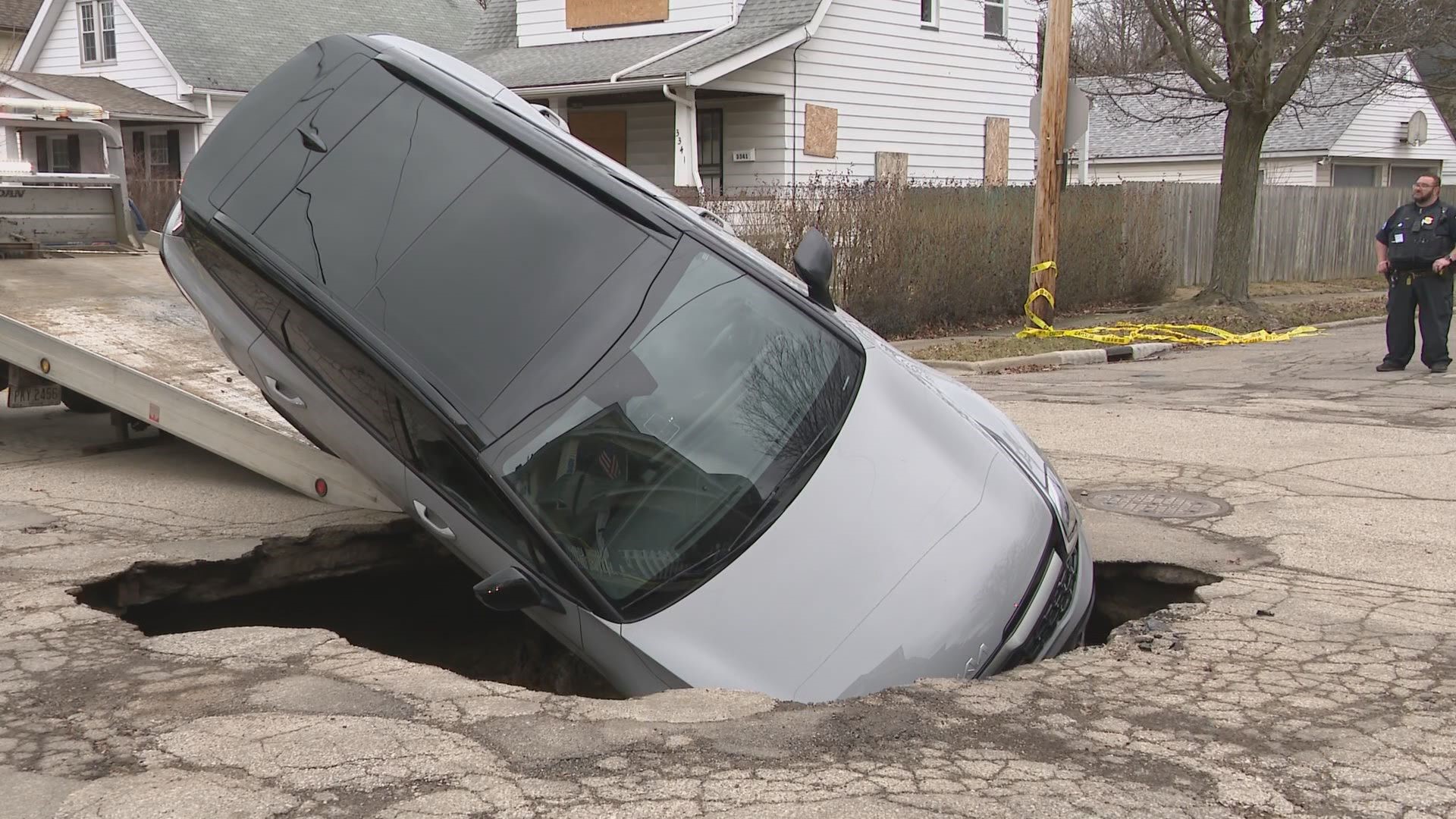 Massive sinkhole swallows up car in Cleveland.