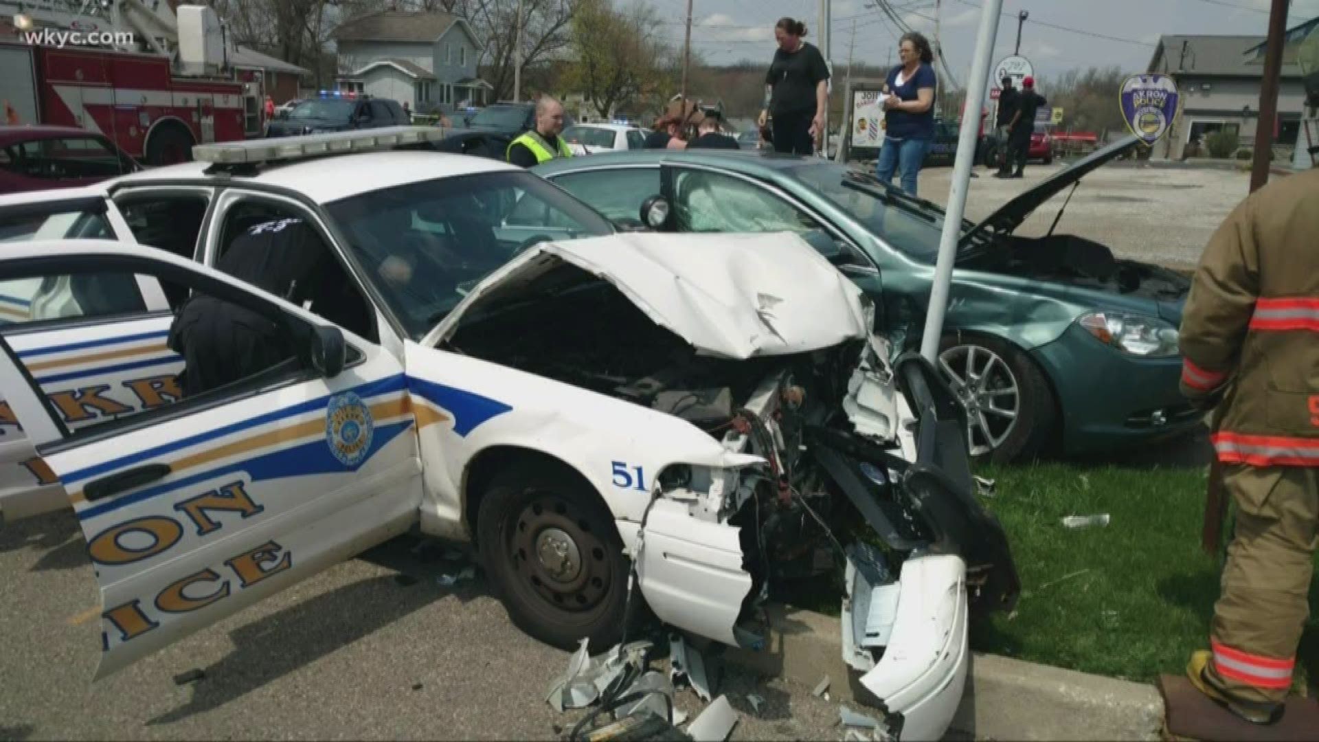 Car crashes into Akron police cruiser assisting with funeral procession