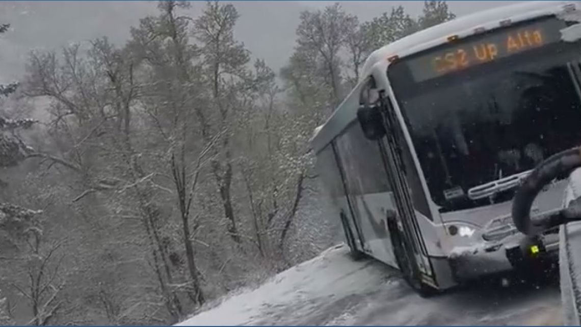 Bus stuck in snowy embankment pulled back onto Utah highway | wkyc.com