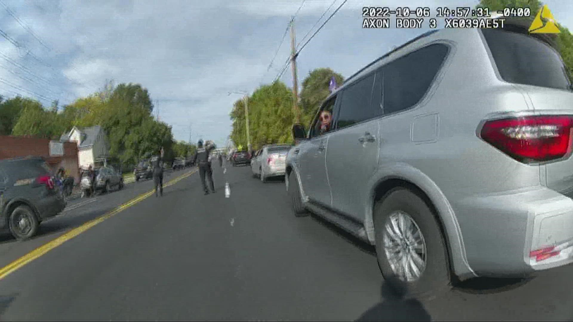 The newly released footage shows the chaotic scene after the crash on October 6 when more shots rang out.