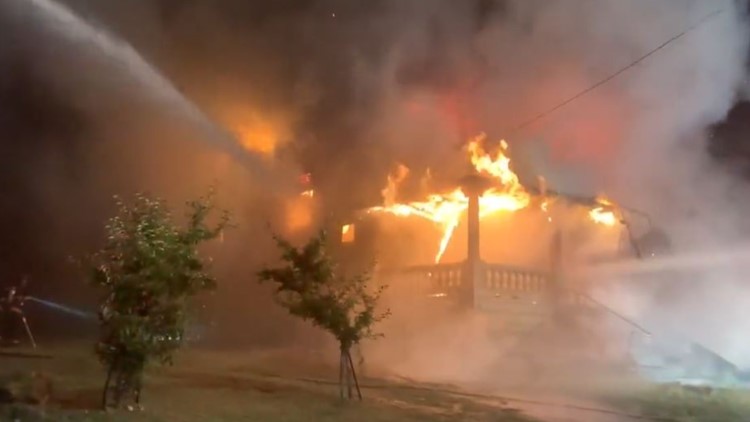 Cleveland firefighters battle intense flames overnight, cite reports of kids throwing fireworks into home