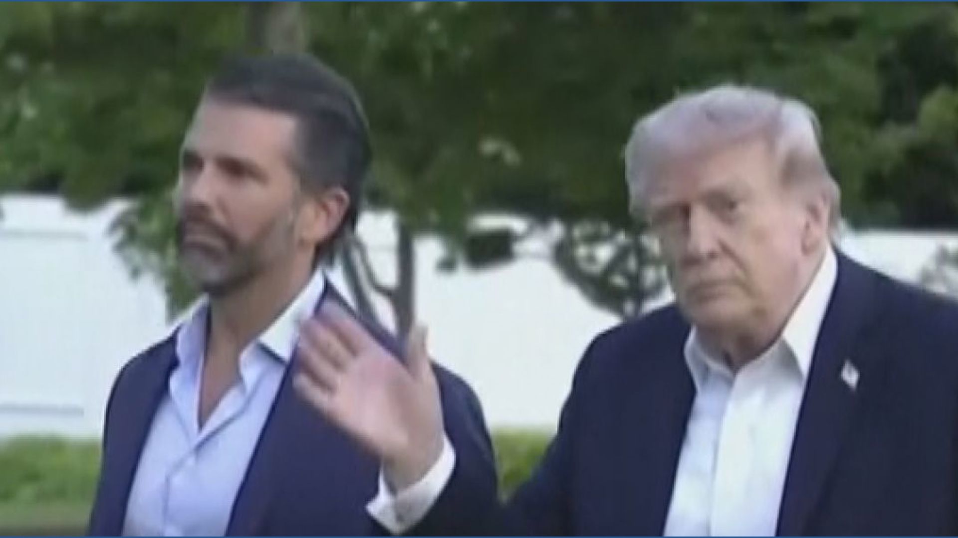 Trump arrives back at White House from Florida with his son Donald
