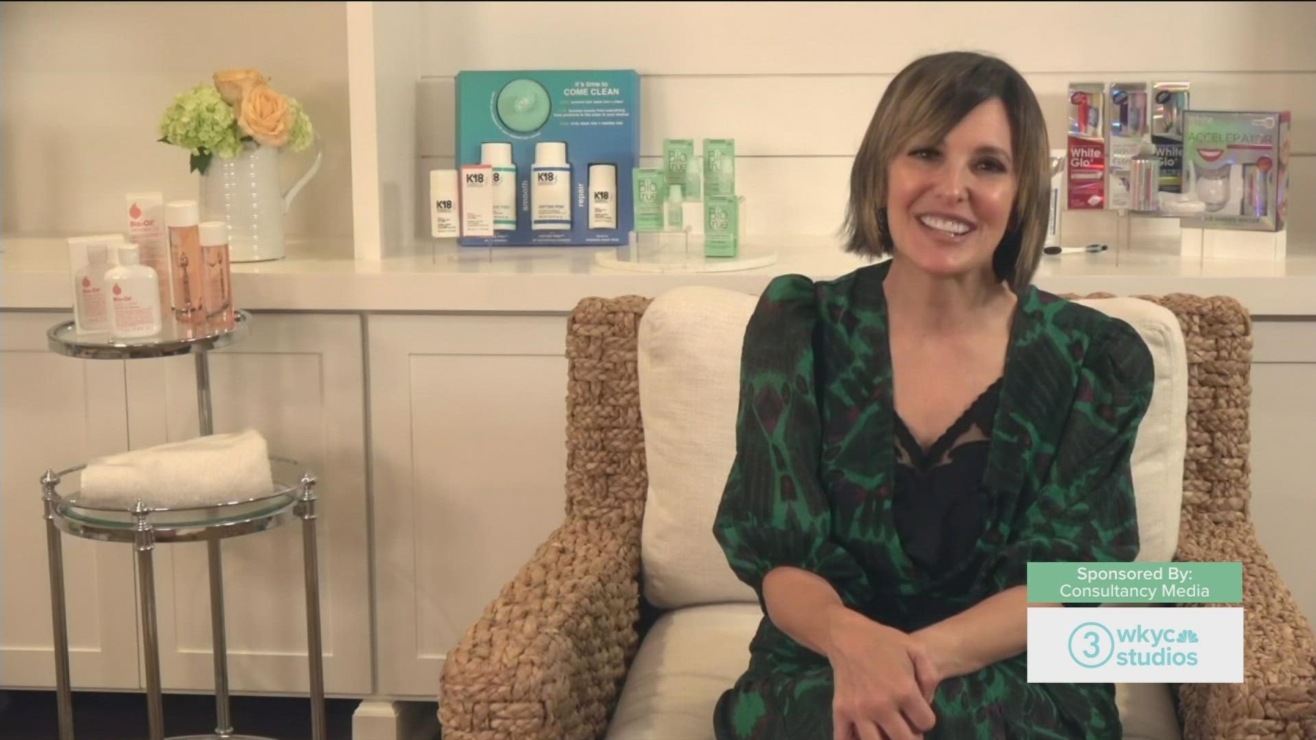 Beauty and Lifestyle Editor Joann Butler shows Ciarra some products for the summer.