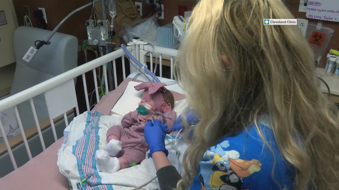 'I'm healing as I'm doing my job': NICU survivor honors late twin sister by caring for premature babies