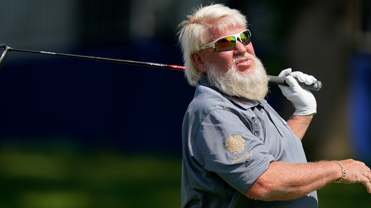 Viral video shows John Daly hitting golf ball across highway and onto Akron high school football field