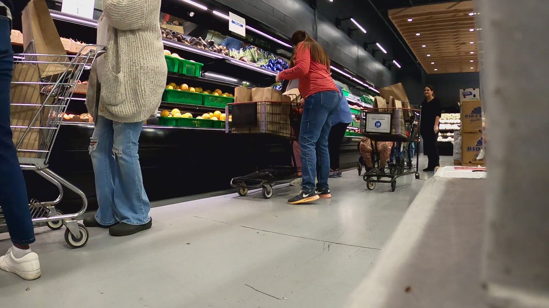 As people file through the market’s grocery store-style set up, complete with shopping carts, they’re able to choose from a variety of foods twice a month.