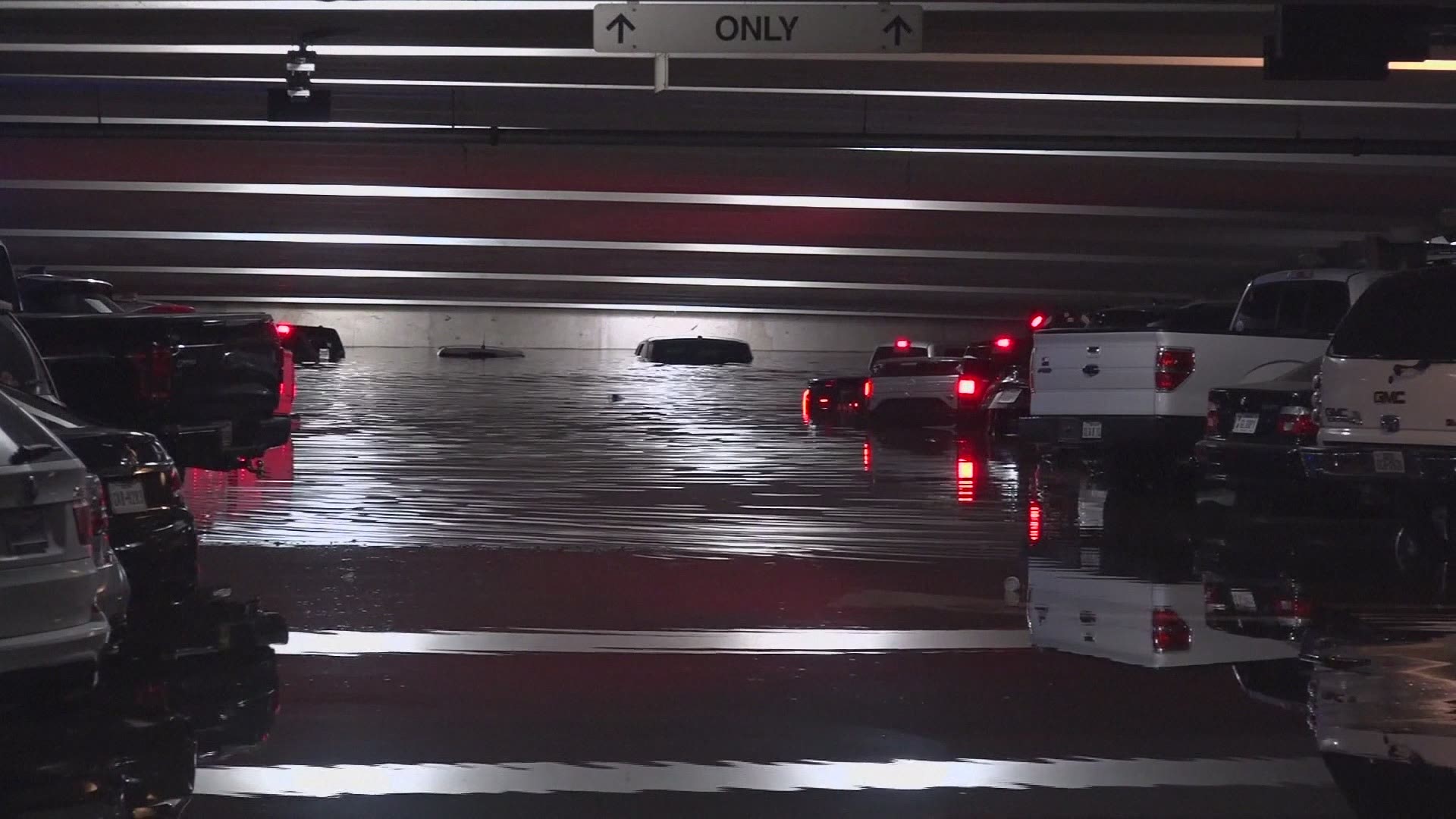 Dozens of vehicles parked at a Dallas airport are underwater after heavy rains moved across much of Texas and brought flash-flood warnings and high-water rescues.