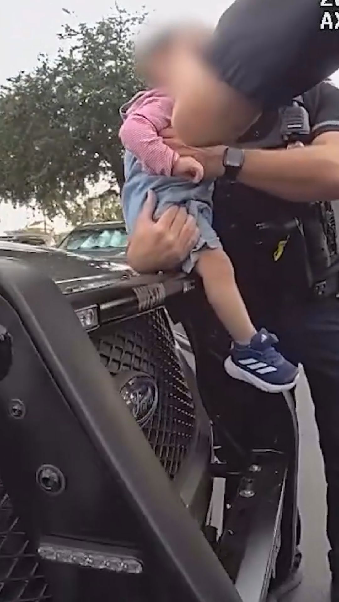 Police officers rescue baby locked in hot van in Florida | wkyc.com