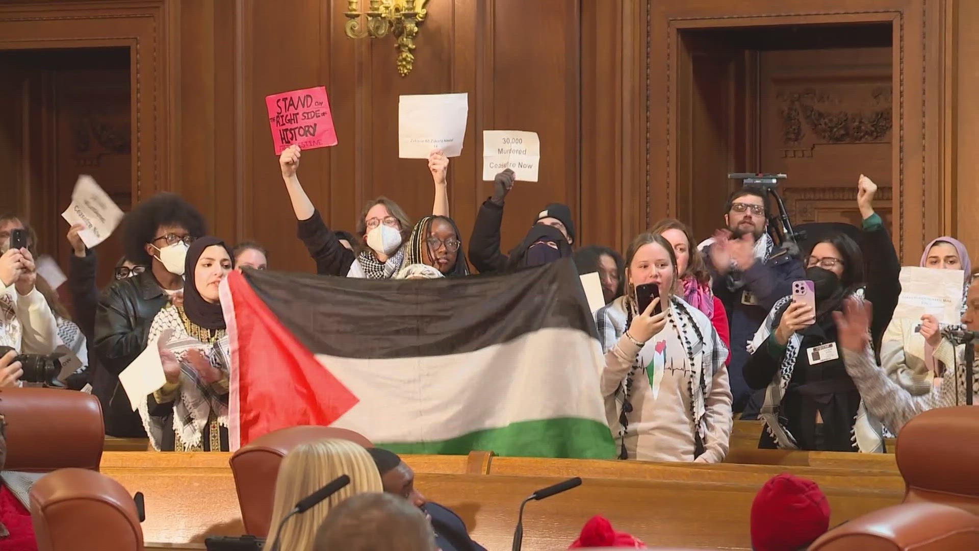 Pro-Palestine protestors could be heard chanting as the clerk read ordinances and resolutions off the agenda at last night's meeting.