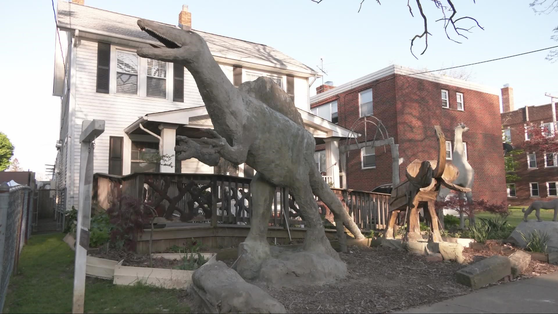 A home up for sale on Bosworth Road in Cleveland is gaining national attention for its dinosaur sculptures.