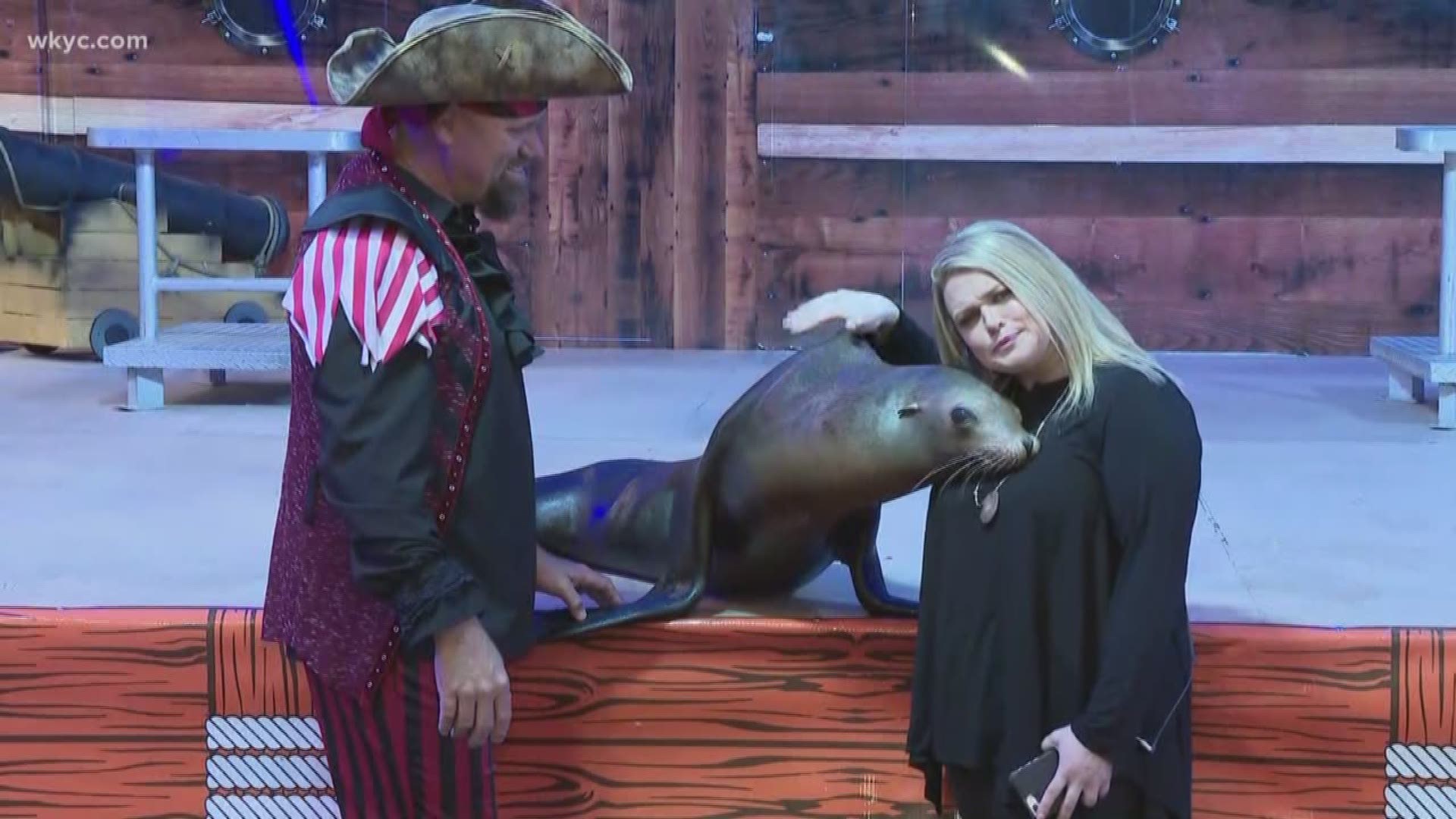 Lindsay hangs out with Captain Jimmy and Zoe the Sea Lion at the I-X Indoor Amusement Park