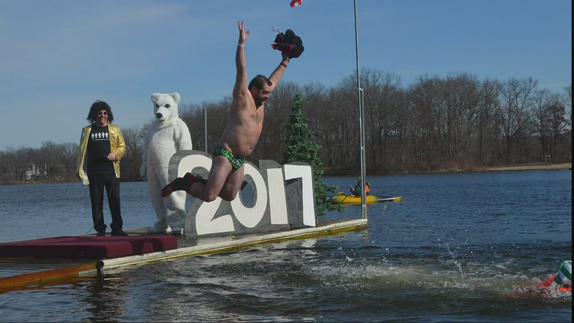 Hundreds dive in wicked cold waters for Portage Lakes Polar Bear Jump