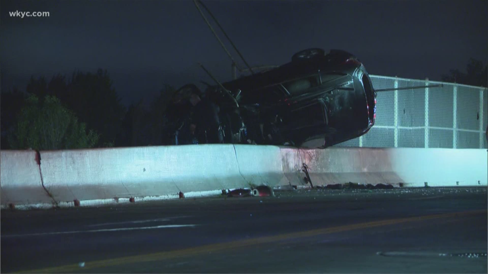 Car hangs over bridge in Cleveland crash, driver hurt