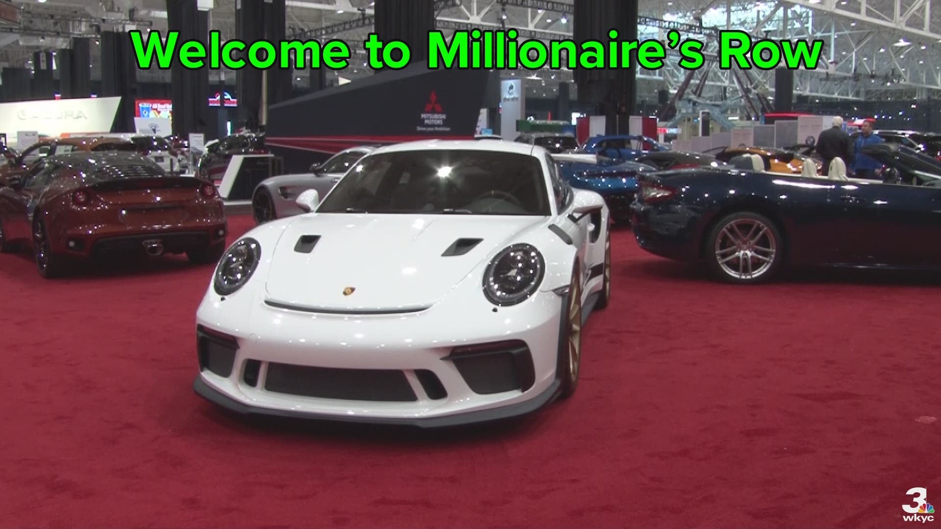 Drooling over expensive vehicles at Millionaire's Row.