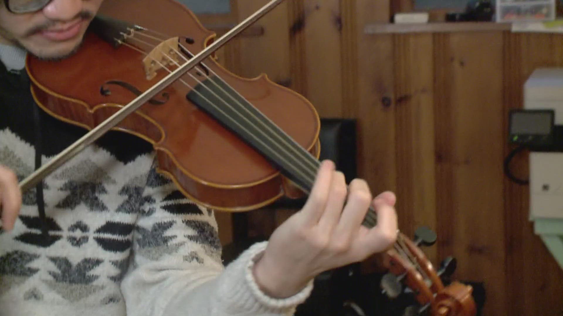 Allen Choo's custom made violin is one of a kind and cost him thousands of dollars to purchase.