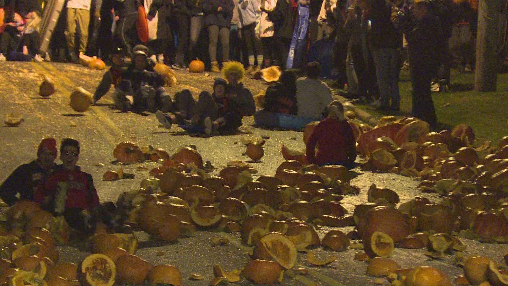 Oct. 26, 2017: Pumpkin carnage was everywhere. Slimy, orange guts covered Grove Hill in what has become a Halloween season tradition known as the Chagrin Falls pumpkin roll.