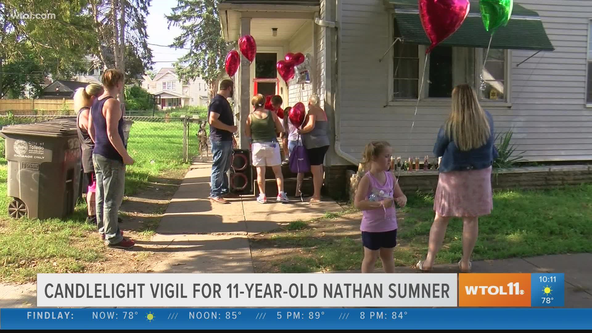 The family held a candelight vigil Friday afternoon to mourn and honor Nathan Sumner, who was shot while playing outside of his own home.