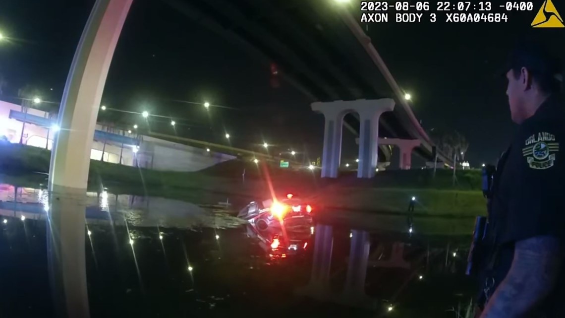 Florida officers rescue driver trapped in car sinking into pond | wkyc.com