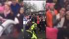 Women's March protesters serenade DC police officer