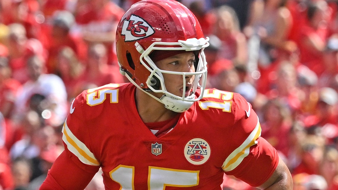 Kansas City Chiefs quarterback Patrick Mahomes (15) rolls out during an NFL  pre-season football game against the Washington Commanders Saturday, Aug.  20, 2022, in Kansas City, Mo. (AP Photo/Peter Aiken Stock Photo 