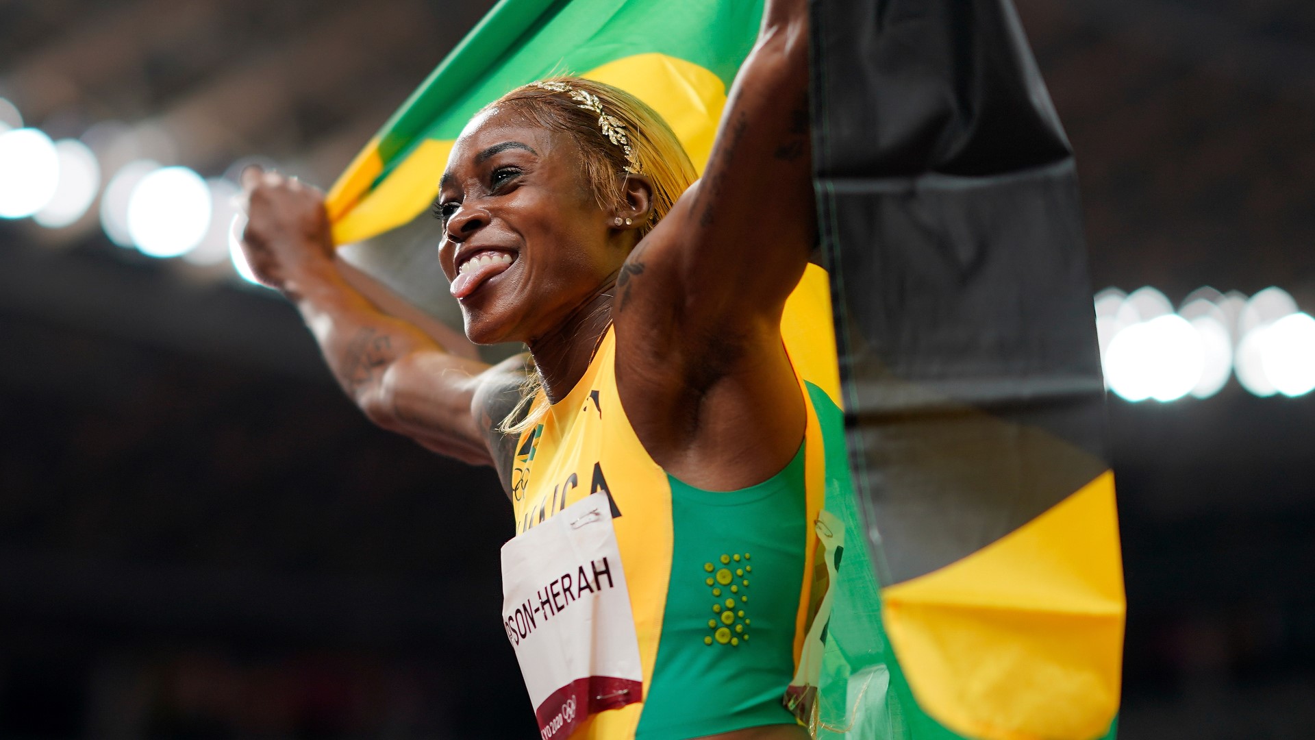 Jamaica's Elaine Thompson-Herah broke a longstanding Olympic record on Saturday in the women's 100 meter race