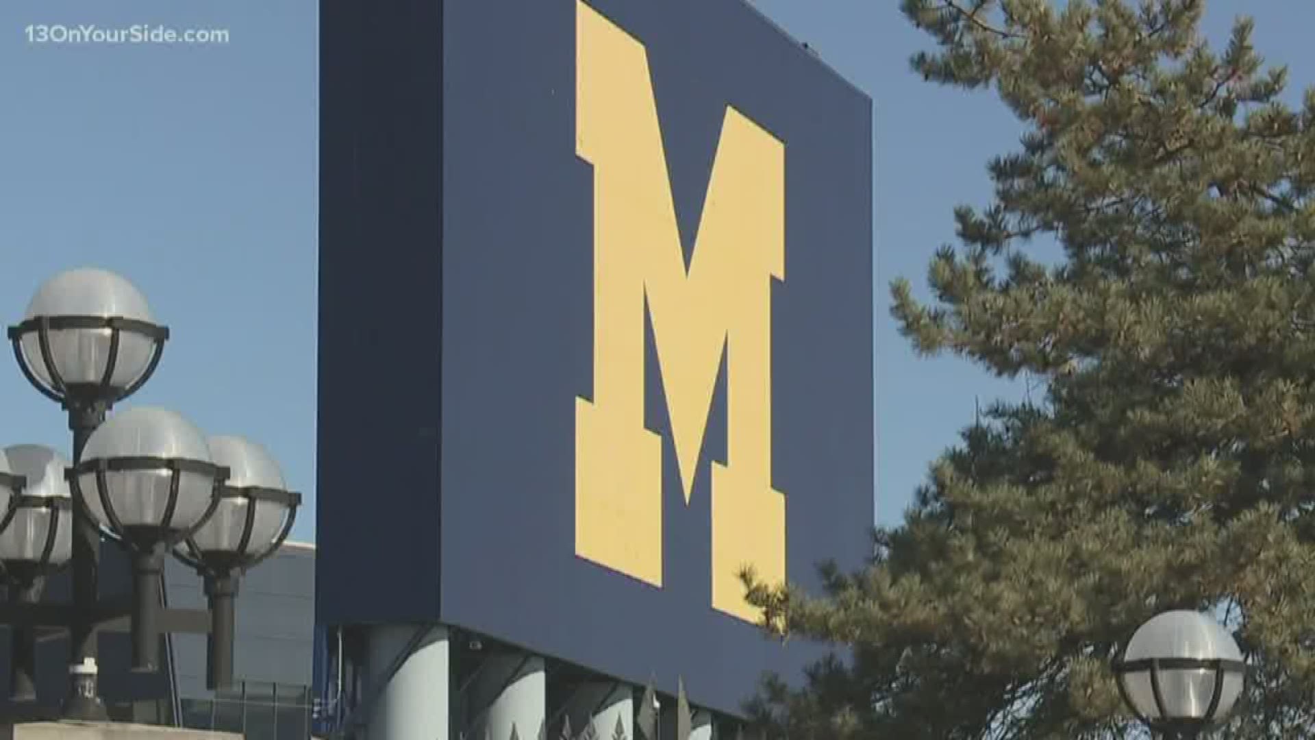 An Olympic wrestler is accusing a University of Michigan doctor of touching him inappropriately during medical exams at the school.