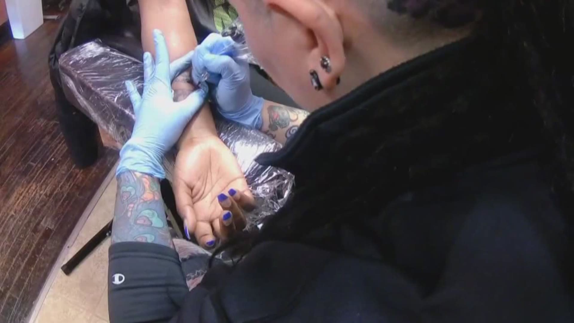 Local tattoo artist works to remove stigma